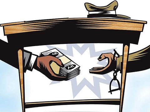 IT department employee caught red-handed taking bribe