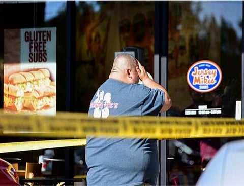 Woman dies in store siege, gunman nabbed