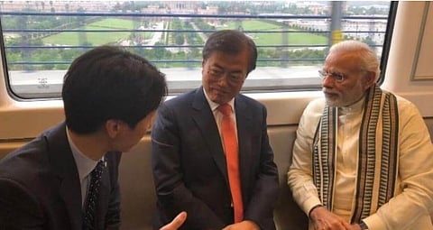 Modi rides with Moon in metro