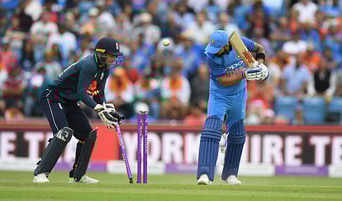 Disciplined England restrict India to 256/8 in series decider