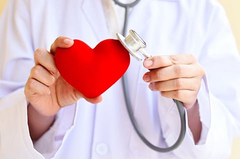 Adhesive patch to reduce heart attack damage