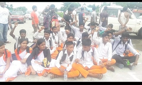 School students of Bhadeaguri High School stage protest on NH-31C against the school authority