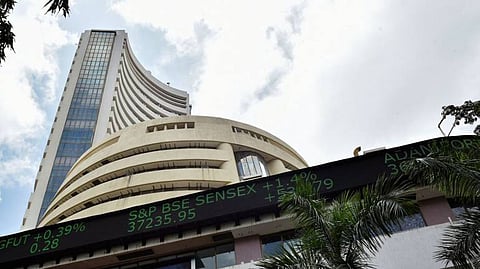 Sensex surges 1,266 points, Nifty ends at 9,112; auto stocks jump