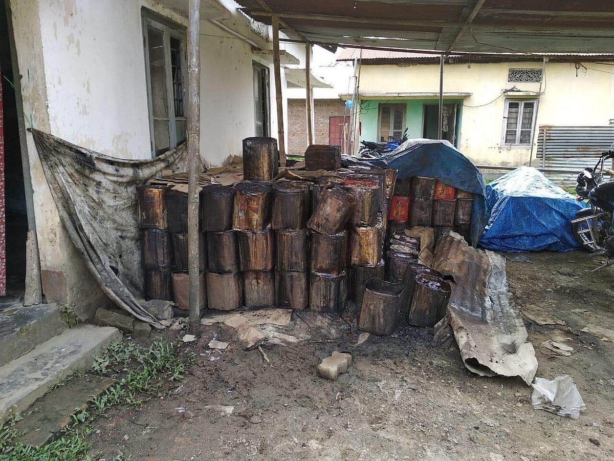 118 treacle tins, two vehicles seized