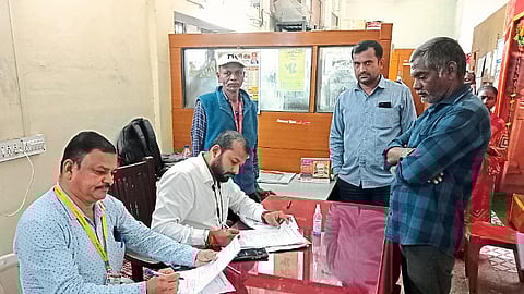 Staff during biometric registration of unregistered hawkers at West Divisional Office
