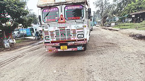 truck Passing through potholes on Dhule highway.