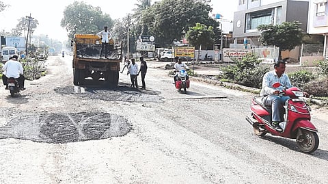 Employees of the department while erecting a bridge across Shantikesar Super Market.