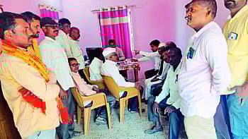 Farmers discussing electricity problems with junior engineer Yogesh Khairnar at the power sub-centre here.