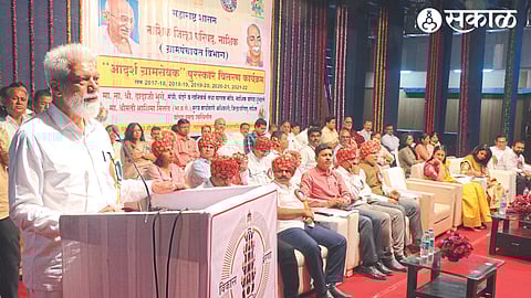 Guardian Minister Dada Bhuse speaking on the occasion of distribution of Adarsh ​​Gram Sevak Award on Monday.