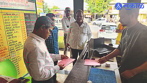 District Collector Gangatharan D. while taking information about the entries in the agricultural service center in the taluk on Tuesday.
