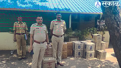 Sub Divisional Police Officer Sachin Hire, Police Inspector Dnyaneshwar Vare etc. along with the liquor seized by the police.
