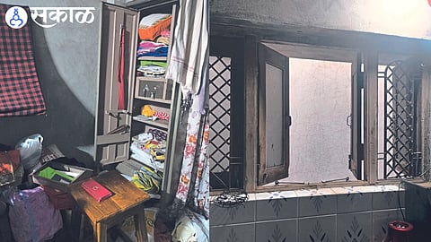 Cupboards broken by burglars and furniture left in disarray and broken window in kitchen