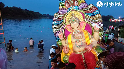 Activists of public board during immersion of Ganesha idol in Girna river basin.