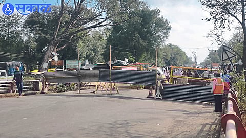 Barricades put up as the railway bridge embankment collapses, closing the bridge to traffic.