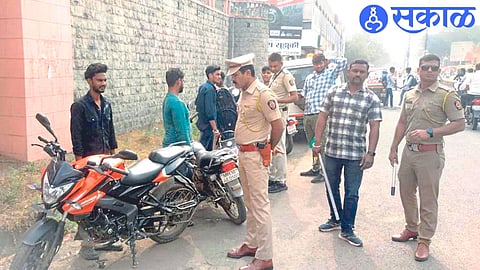 Police officers and personnel participating in the inspection drive near a college in Deopur.