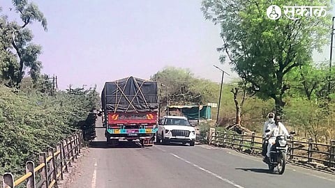 A motorist practicing on the bridge over the Burai river in Chimthane after the thorns came on the road.