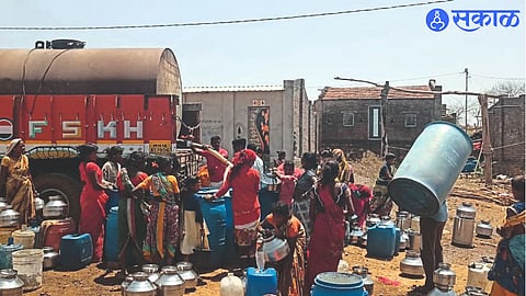 As soon as the water tanker arrived at the tribal settlement, there was a rush to fill the water