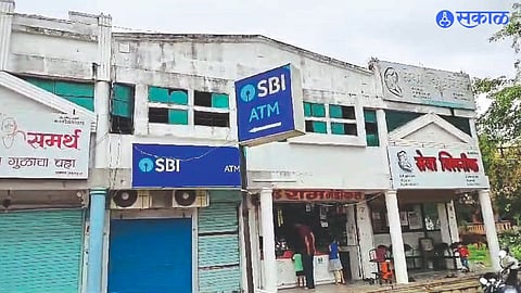 Officials inspecting an ATM in Rasiklal Patel Nagar. ATM center closed after incident