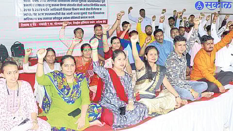 Contract arts, sports and computer teachers of tribal development department while protesting on Monday.
