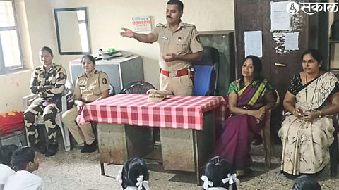 A. T. Senior Police Inspector of Mhasrul Police Station Atul Dahake while interacting with the students of Pawar Secondary School, Primary and Secondary Ashram Schools.