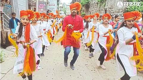 Students of Muktananda Vidyalaya performing a procession and performing cymbals on the occasion of the arrival of Ladkya Bappa on Saturday.