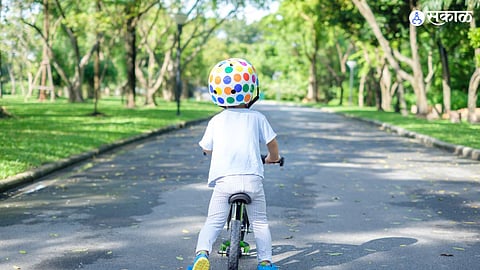 Representational Image of Kid riding cycle