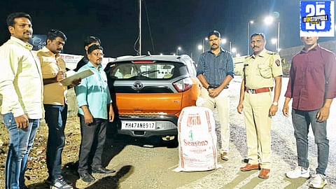 Police officers inspecting the vehicle after a ganja seizure near Jungli Hotel, with the driver fleeing the scene upon being asked for vehicle documents.