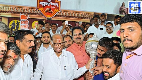 Sharad Pawar presents the silver mace to Maharashtra Kesari Vetal Shelke, highlighting the need for more wrestling competitions to revive the sport’s golden era.