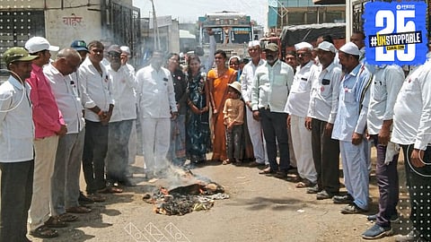 Farmer leaders in Shrirampur setting fire to Mahayuti’s manifesto during a joint protest against unfulfilled promises.