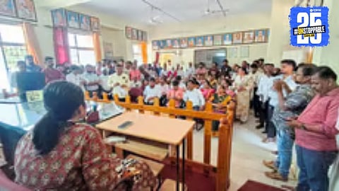 Police officials displaying the two swords seized during a raid on an unauthorized training camp in Sateli-Bhedshi.