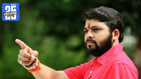 Ravi Kant Tupkar addressing locals against the proposed cement plant, warning of protest with farmers.