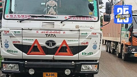 The accident scene at Kolhapur Naka where a container ran over a biker, leading to his death and traffic disruption.
