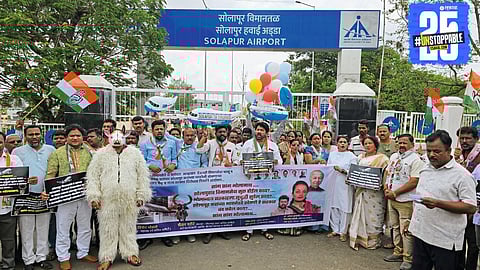 Congress leaders fly toy planes during protest questioning the launch of long-promised flight service.
