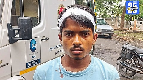 The loyal dog who saved a youth from a leopard attack stands beside his owner after the incident.