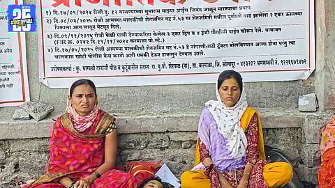 Women and girls sit in protest demanding police action and justice against FIR pressure.