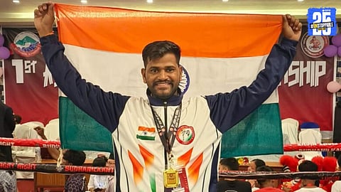 Sagar Shelar proudly holding the Indian flag after winning gold in Nepal’s Asian Mixed Boxing Championship; Satara showers accolades.