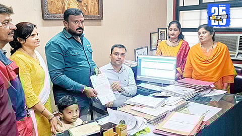 Former corporator inspects pothole-ridden road in Satara; warns of protest if repairs delayed.