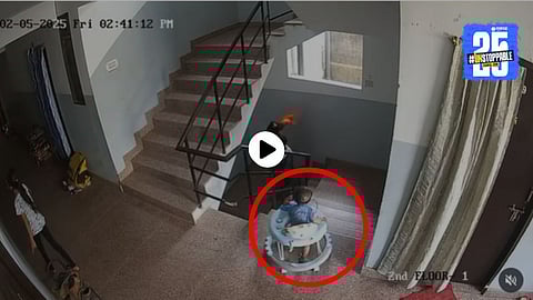 A toddler in a walker dangerously approaches the stairs as no adult notices — a terrifying moment caught on CCTV that has gone viral