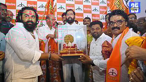 Deputy CM Eknath Shinde welcomes 150 new workers into Shiv Sena during a party expansion event in Ahmednagar.