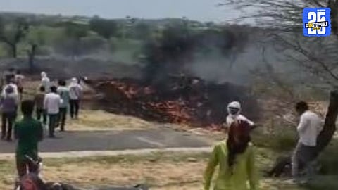 Wreckage of the Indian Air Force aircraft scattered across the crash site in Rajasthan; pilot and crew feared dead as rescue operations continue.