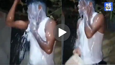 Manik Ali from Assam pours milk over himself in a symbolic milk bath outside his home to celebrate his legal divorce from his unfaithful wife. The act, captured on video, has gone viral on social media.