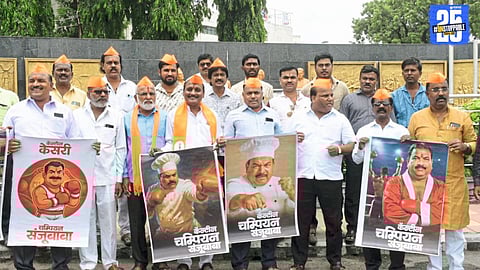 Uddhav Thackeray party workers protest with a ‘Canteen Kesari’ placard targeting MLA Sanjay Gaikwad.