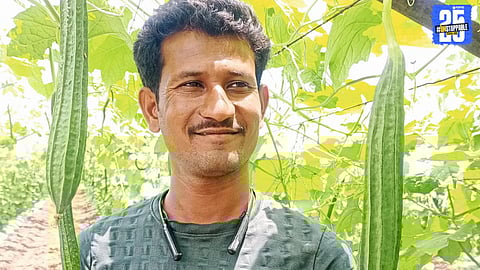 A proud farmer with his ridge gourd harvest, cultivated using organic methods to reduce costs and achieve debt freedom.