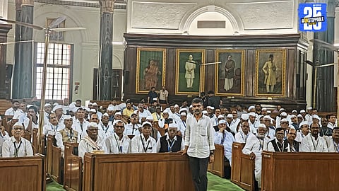 Retired teachers pose proudly outside the Indian Parliament during their special visit organized by MLA Nilesh Lanke — a tribute to their lifelong service.