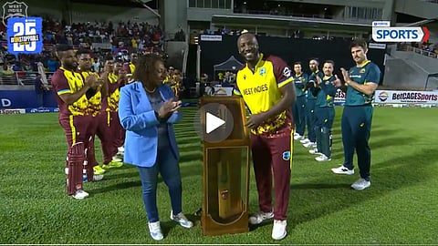 Andre Russell smashes a brutal six into the sightscreen in his farewell match
