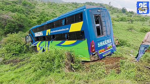 Wreckage of the luxury bus after it fell into the Karanji Ghat valley; eight passengers critically injured.