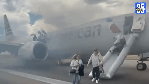 "Fire erupts in landing gear of American Airlines Flight AA3023 during takeoff at Denver Airport. All 173 passengers and six crew members were safely evacuated amid smoke and flames."
