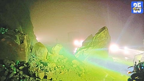 Massive landslide in Karul Ghat halts vehicular movement; rescue teams clear debris from the road.