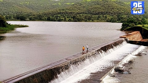 Villagers risk lives by walking over algae-covered spillway of Mahind Dam; urgent action needed by Irrigation Department.