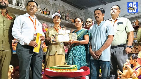 Officials hand over President’s invitation to Anjana Kumbhar at her residence in Parli."